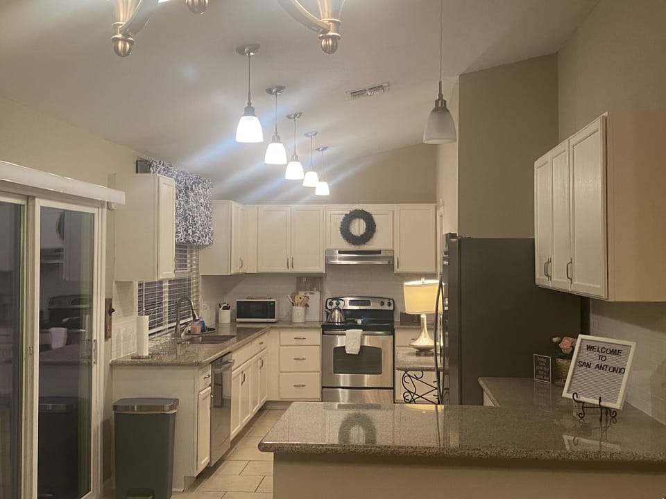 Plenty of counter space. Fridge with ice dispenser stocked with water bottles.