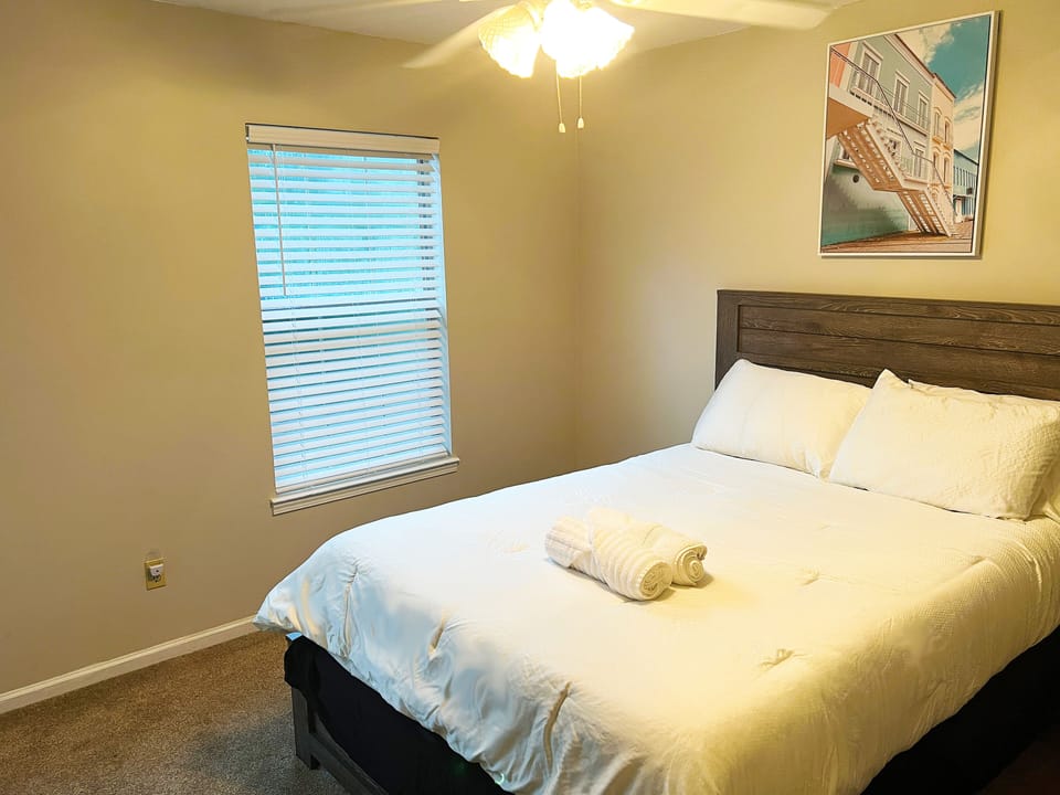 Bedroom 2 that features a queen bed setup along with TV.