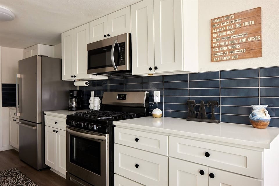 Modern yet classic white shaker cabinets with soft close doors and drawers, beautiful timeless white quartz countertops. Full kitchen with full size appliances, gas stove, vented microwave, dishwasher and large basin sink