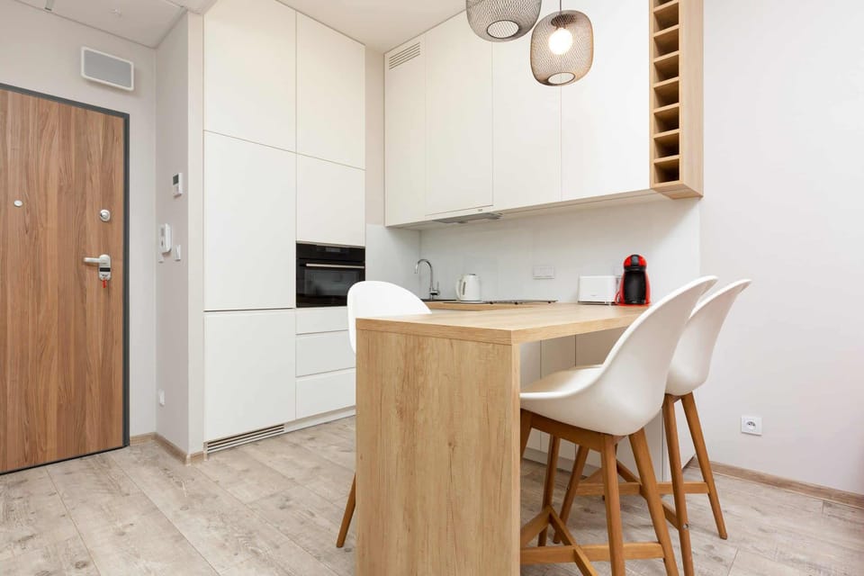 Modern kitchenette which has all the necessary accessories and equipment for preparing home-cooked meals.