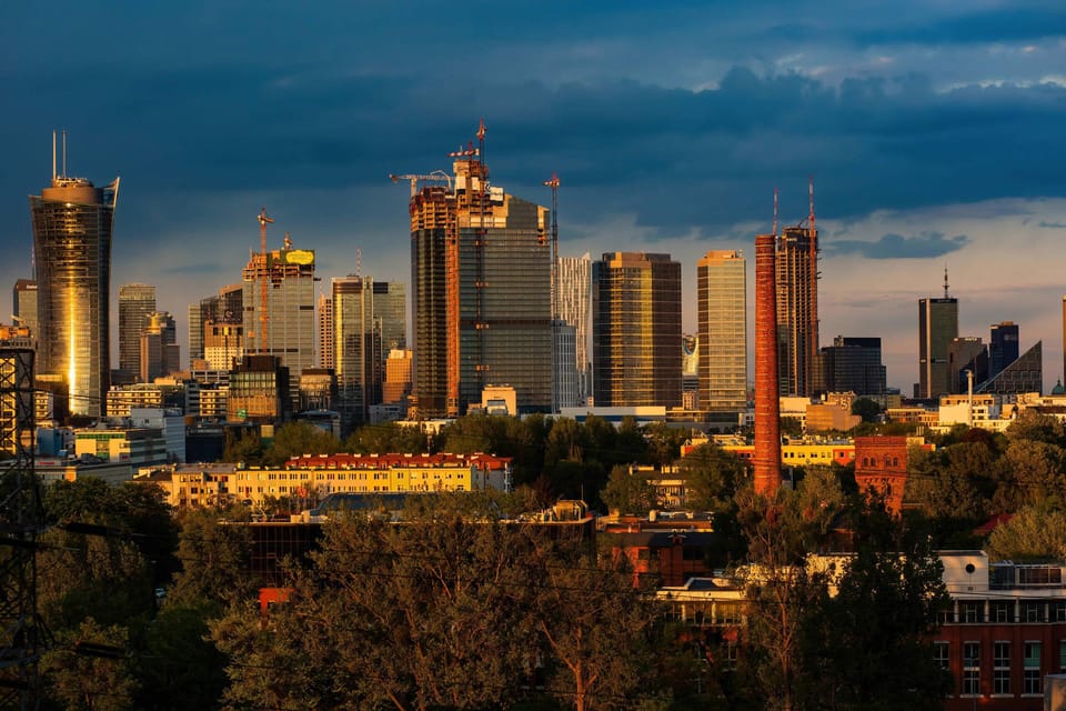 Stunning nighttime view of a bustling urban skyline, showcasing architectural landmarks and city lights.