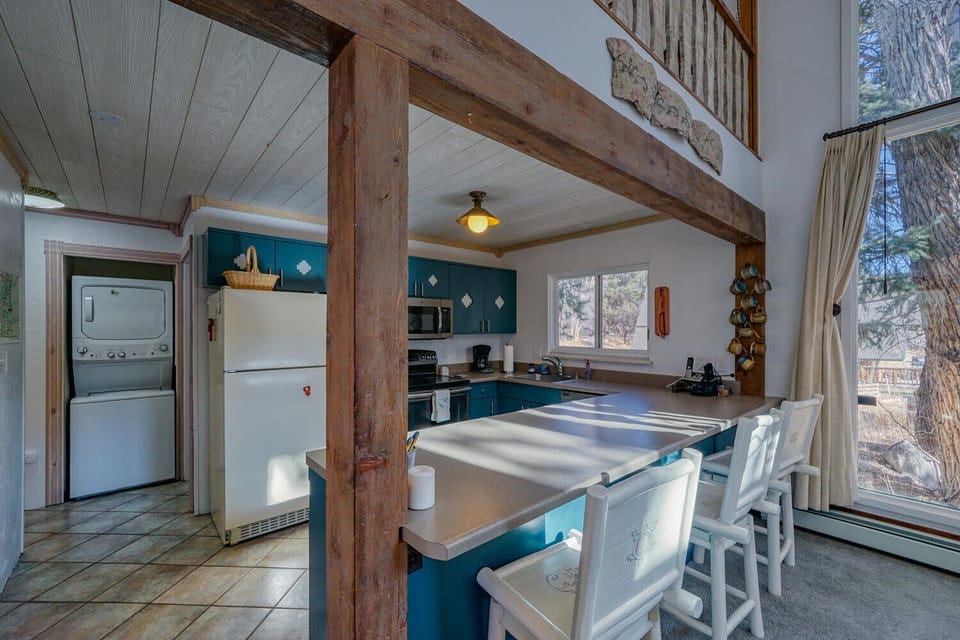 Fully-appointed kitchen with bar seating.