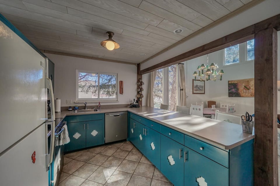 Fully-appointed kitchen with bar seating.