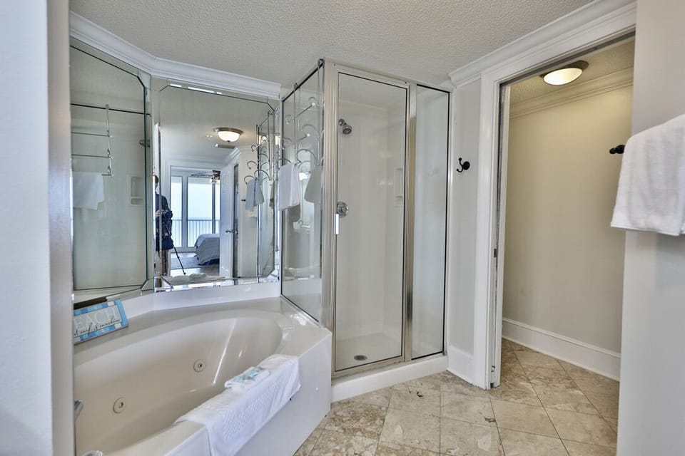 Separate shower and tub in the master bathroom.