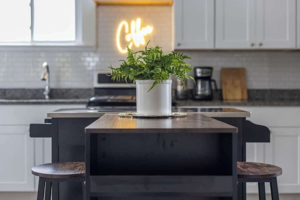 Kitchen island w/ bar seating & pendant lighting for casual meals