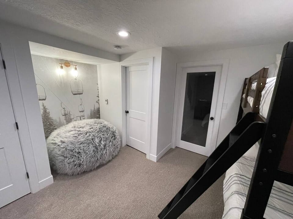 There is a set of bunk beds on the lower level for additional guests. There is also a large beanbag chair/pillow to relax on the floor.