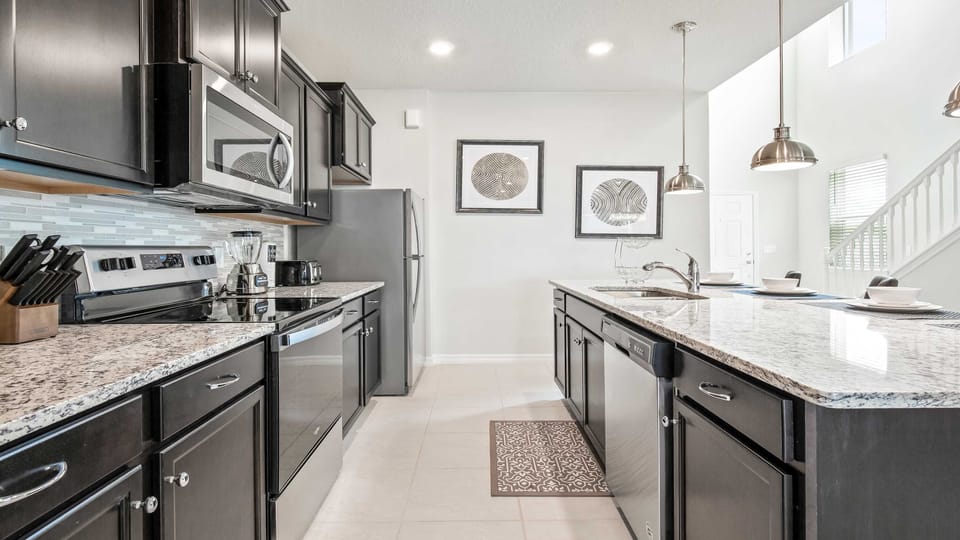 Compact kitchen, featuring a charming mini breakfast bar for cozy morning gatherings