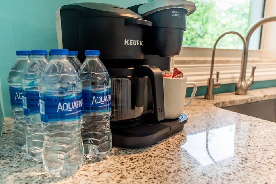 Keurig Duo brews a pot or pods. A starter pack of pods are provided. Filtered water is available with a reverse-osmosis system at the kitchen sink. 