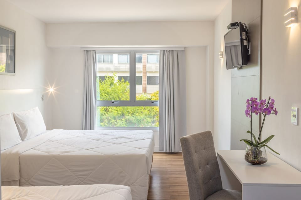 Standard Triple Room | Minibar, in-room safe, desk, laptop workspace