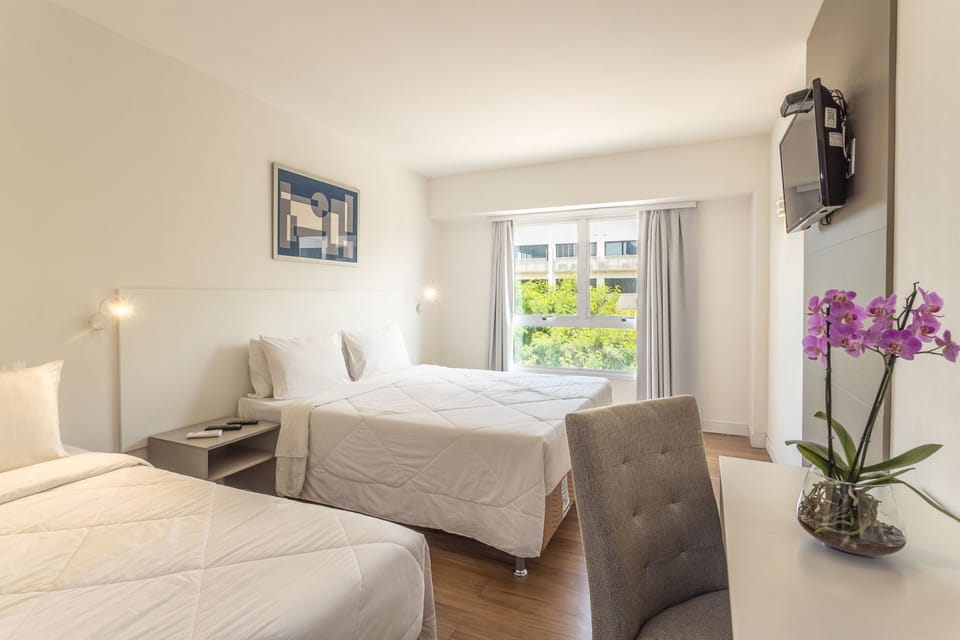 Standard Triple Room | Minibar, in-room safe, desk, laptop workspace