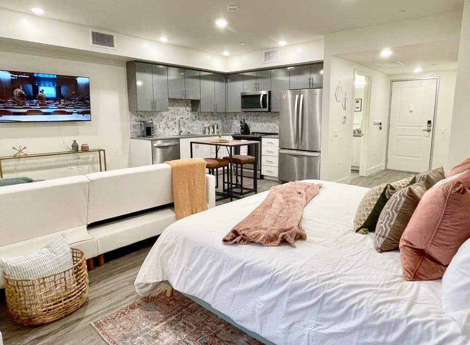 King Bed outfitted with luxury bedding atop a supportive hybrid mattress