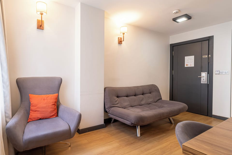Junior Suite | Living area | 109-inch LCD TV with satellite channels