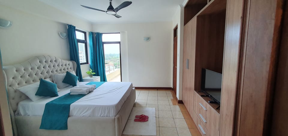 Master bedroom with private balcony and smart tv w/ netflix