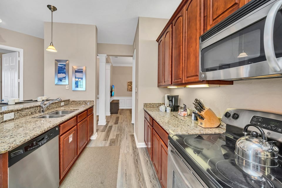 This stylish kitchen captures the essence of modern design, blending functionality and aesthetics seamlessly for a perfect cooking and gathering space.