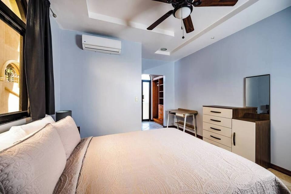Spacious walk-in closet in the master suite at Guapinol condo, Langosta Beach—ideal for extended stays, with plenty of room for beachwear, surf gear, and evening outfits. A practical touch in this Tamarindo vacation rental.