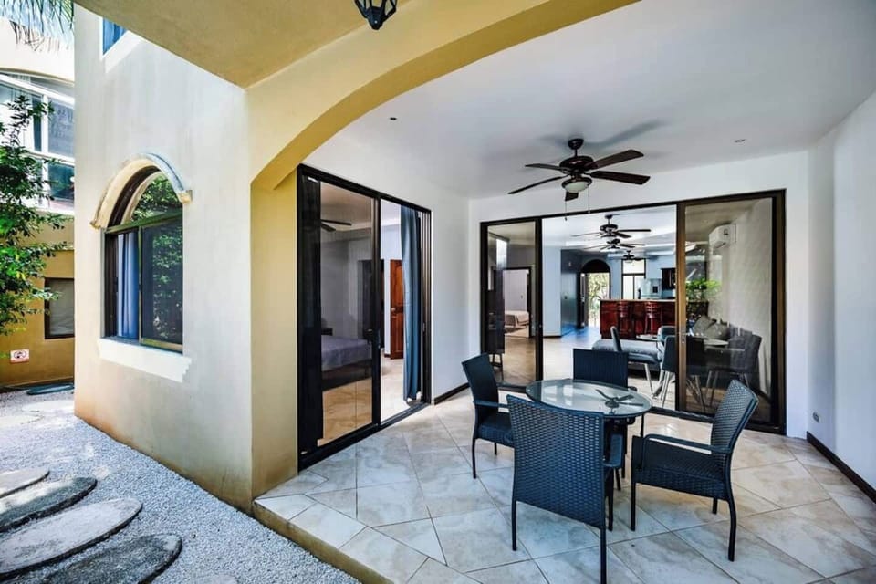 Spacious terrace at Guapinol condo in Langosta Beach, Tamarindo—just steps from the shared pool and surrounded by tropical gardens. Enjoy open-air lounging in a peaceful setting, walking distance to Playa Tamarindo and local restaurants.