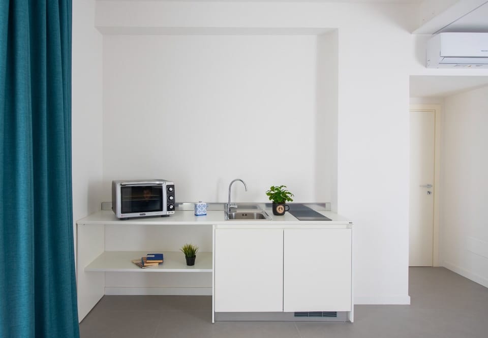 Superior Quadruple Room, Ensuite, City View (Con angolo cottura) | Shared kitchen