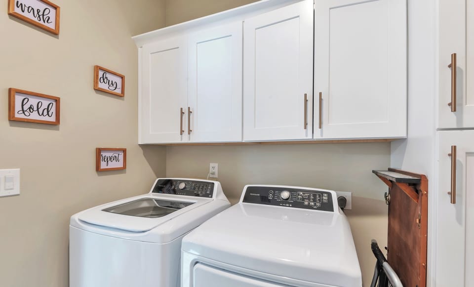 Laundry Room with convenient washer and dryer.
