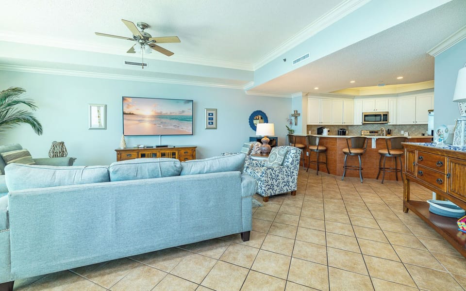 Sink into cozy armchairs in your living room as your favorite movie plays on the large flat screen TV