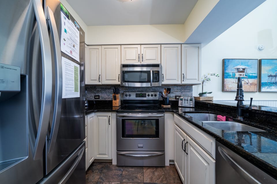 Stainless steel appliances, granite counter tops and subway tiles