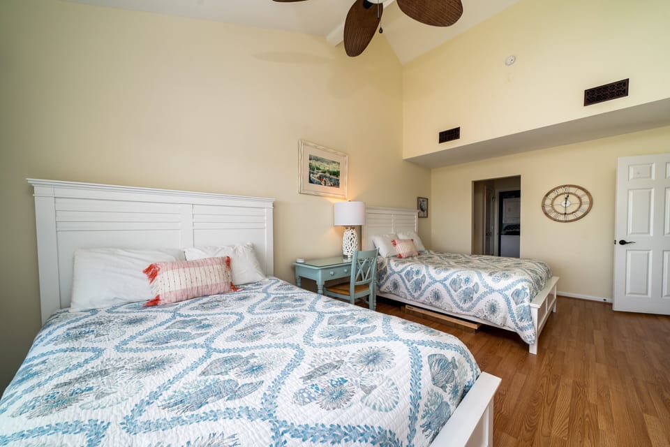 The guest bedroom has two queen beds and a desk for any "work from home" needs