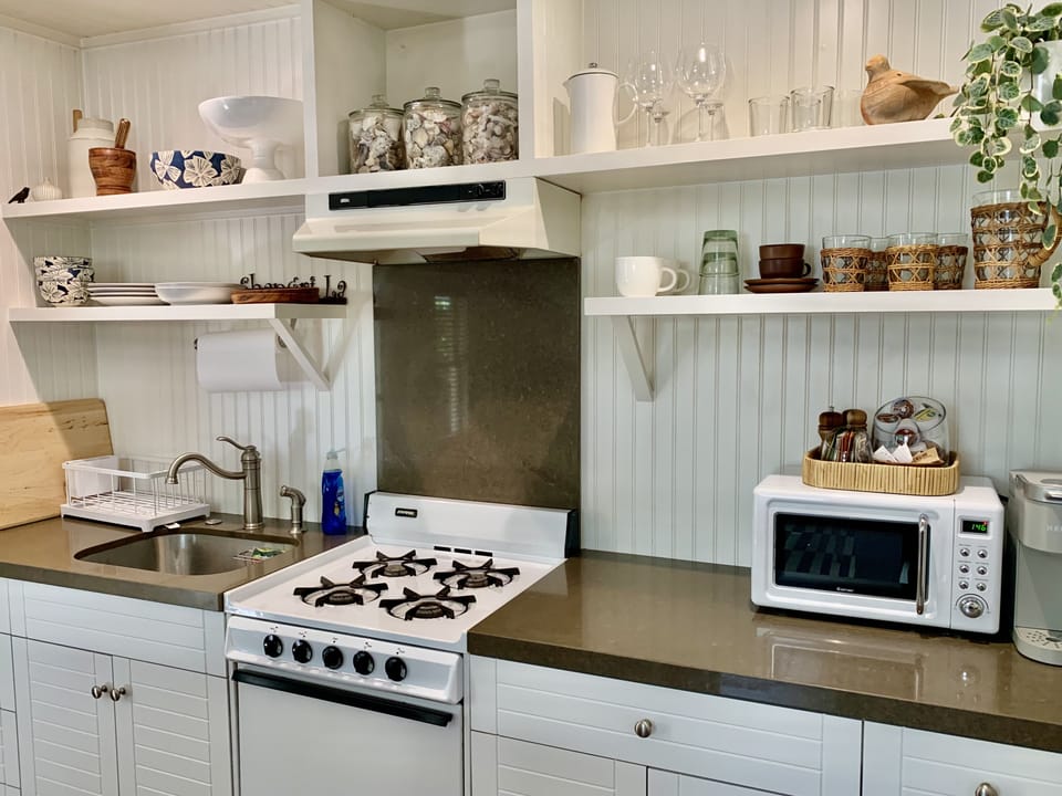 stocked kitchen with everything you will need to cooking and dining
