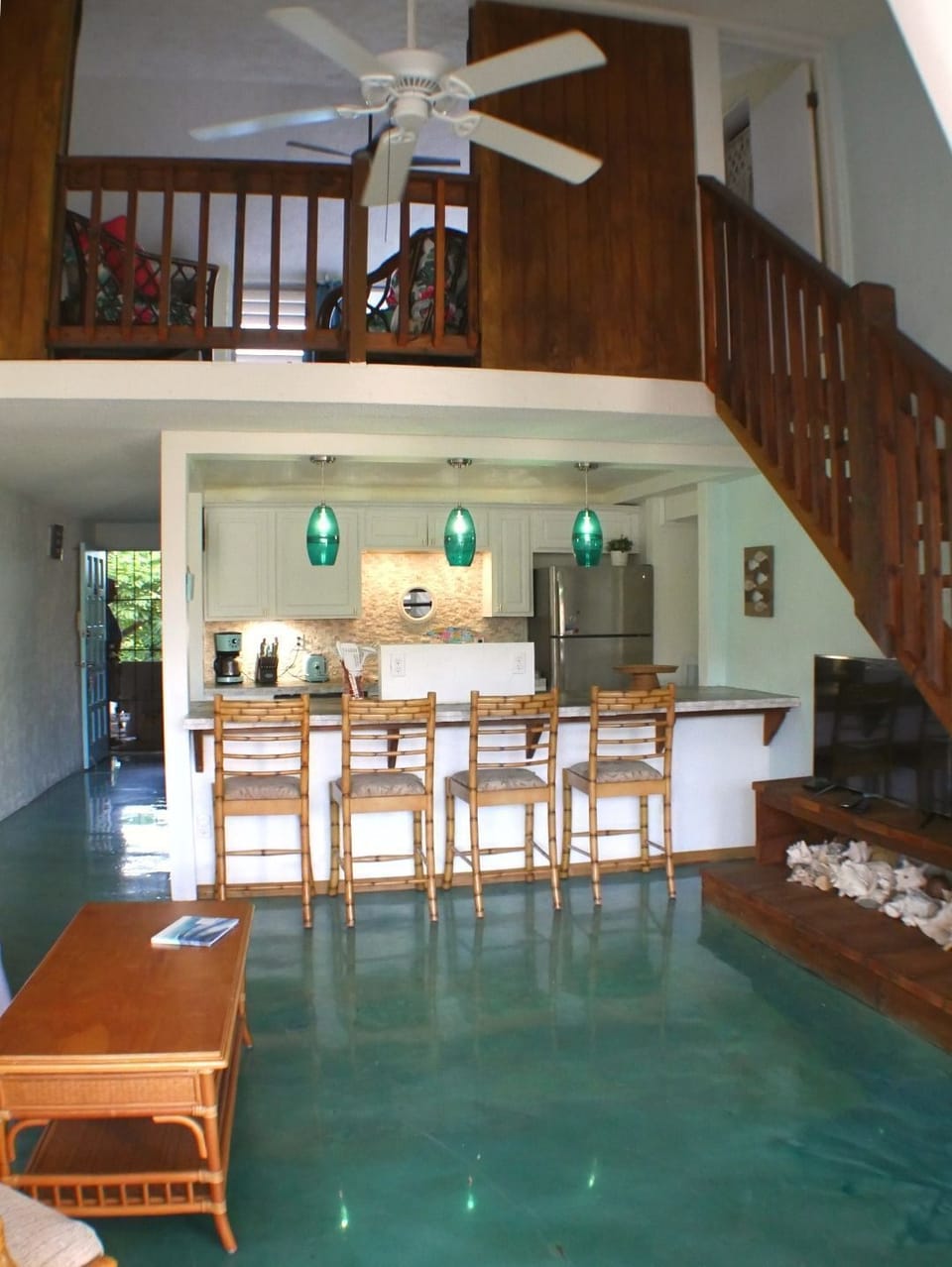 View of kitchen, stairs, and main hall