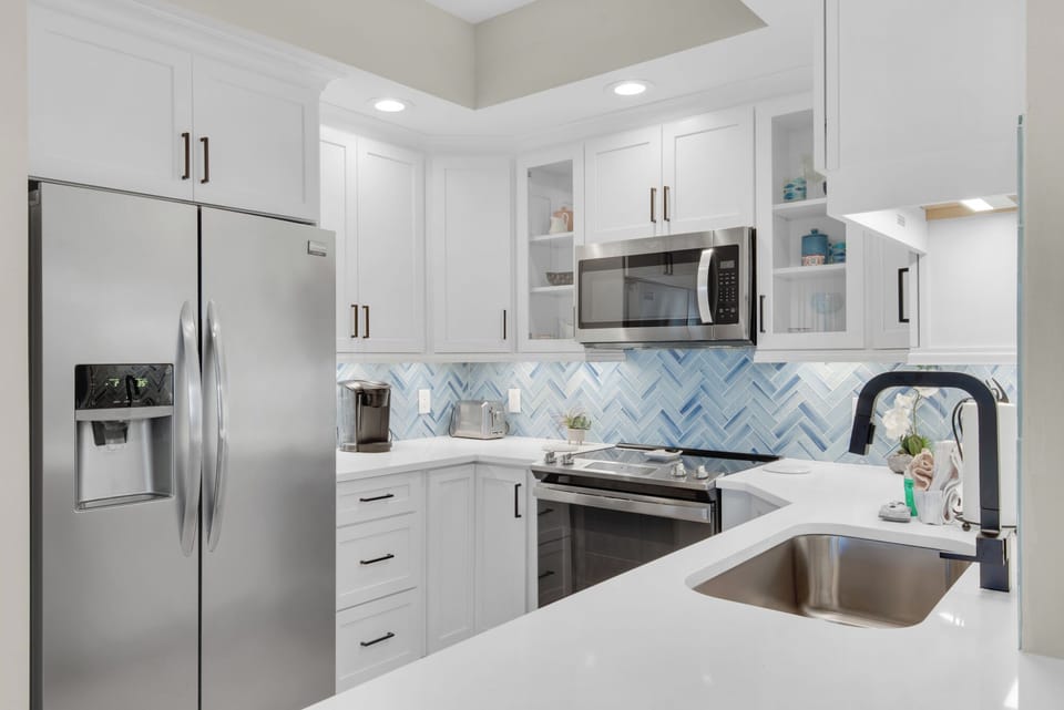 New kitchen with gorgeous backsplash and stainless appliances!
