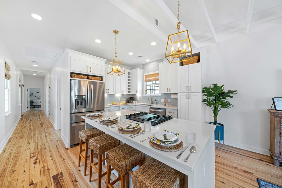 Quartz countertops. Extra large fridge. oversized island.