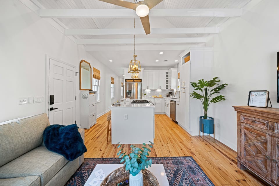 Fully stocked kitchen and living room. High ceilings. Exposed beams.
