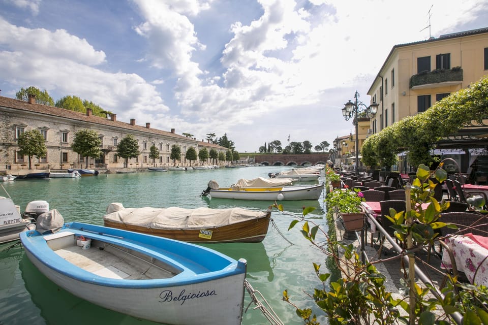 The river Mincio in Peschiera del Garda with teraces and restaurants