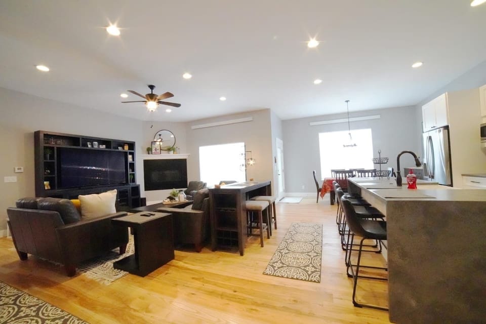 Whether you are relaxing in the living room, eating at the dining room table, or hanging in the kitchen, you are always a part of the fun in this home. 