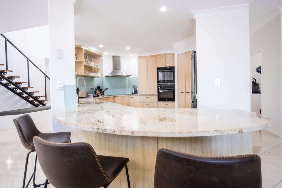 Island seating around one of the kitchen counters.
