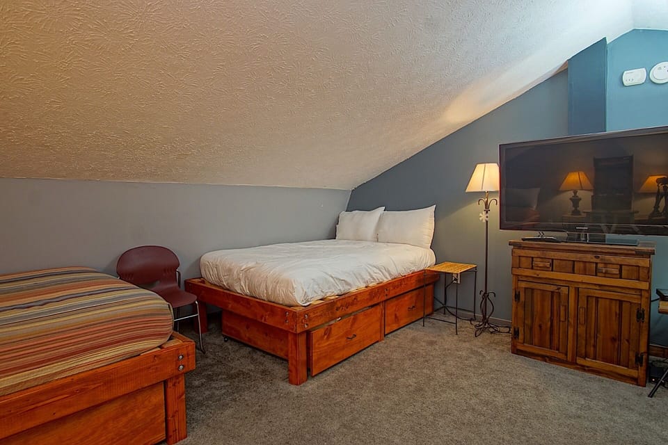 The loft has two full sized beds and a queen