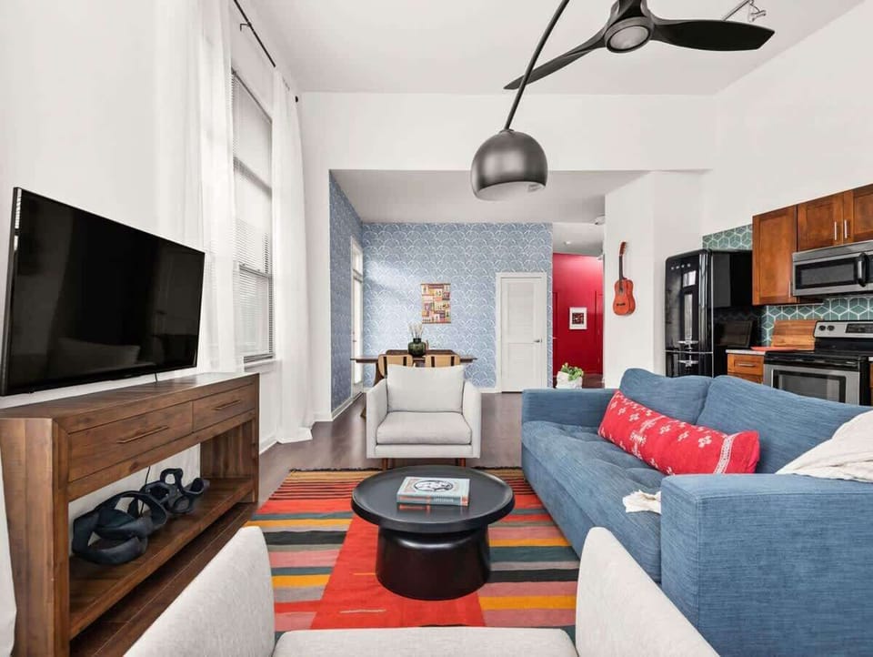 From the hallway, walk to a spacious dining/ living room with 15ft ceilings!