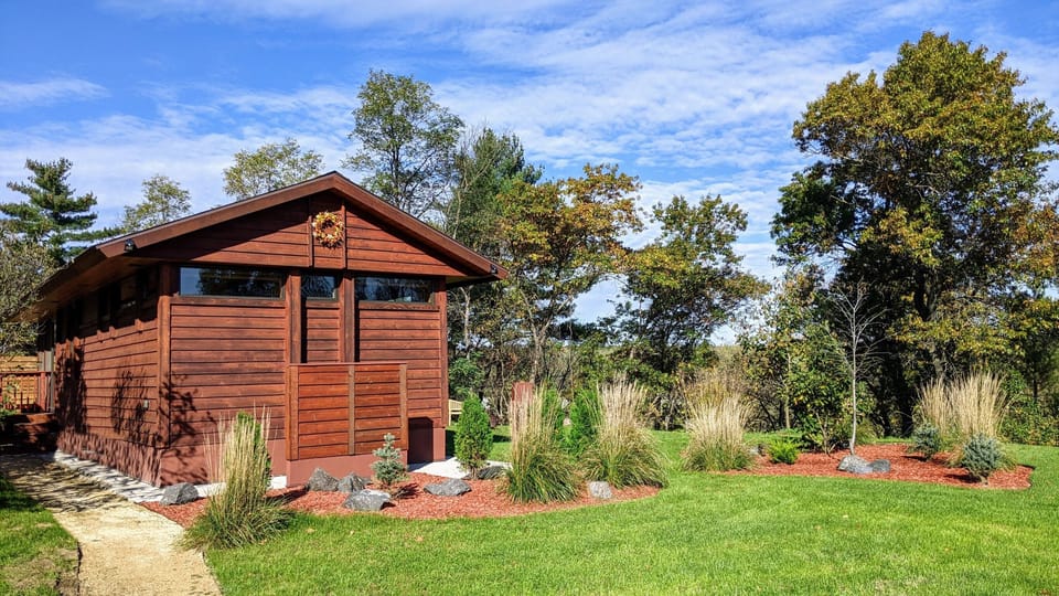 Follow the path from your parking spot to Tiny's screen porch and entrance.
