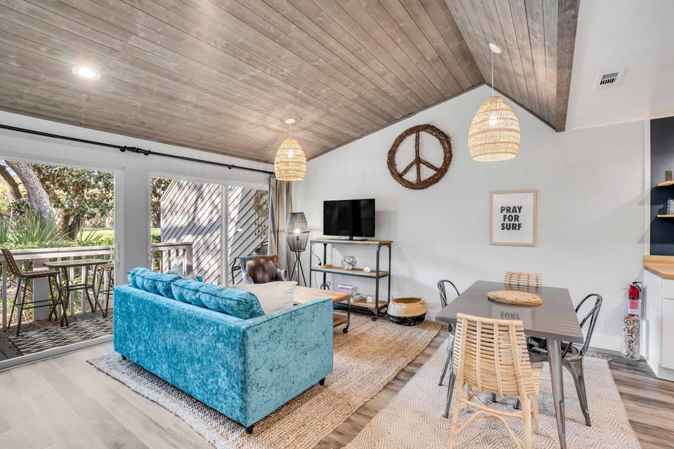 Relax in the living room with high ceilings and full size pull out sofa.