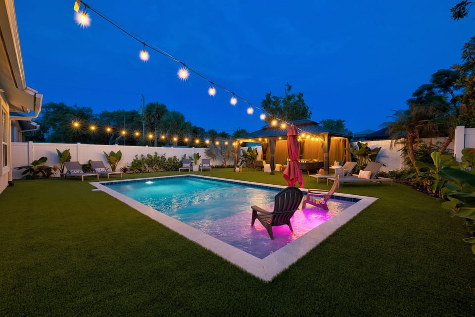 Backyard lit up at night for resort-style vibes