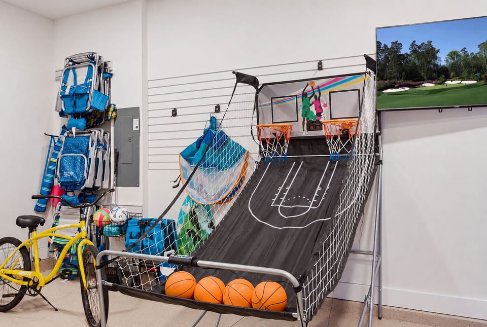 Keep the competition going with indoor arcade basketball and a TV for game-day entertainment.