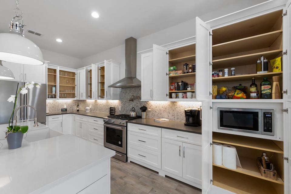 Fully stocked kitchen with spacious cabinetry and everything you need for easy meals and entertaining.