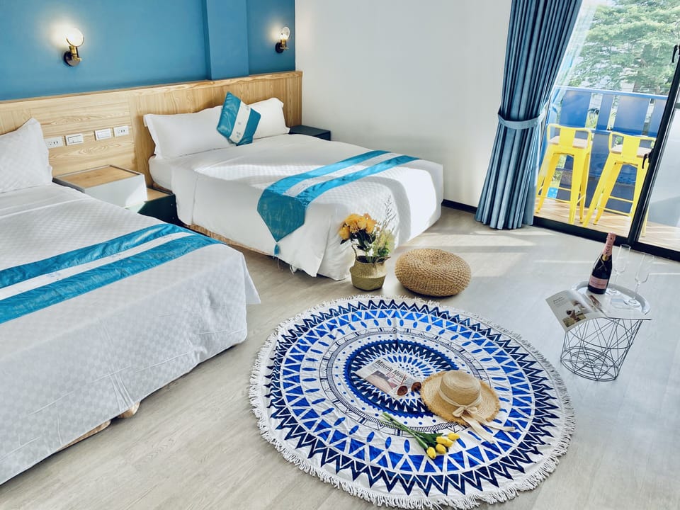 Quadruple room City view with Balcony | 1 bedroom, down comforters, desk, laptop workspace