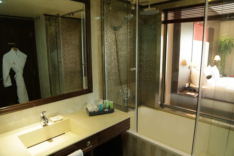 Deluxe Double or Twin Room | Bathroom | Deep soaking tub, hydromassage showerhead, designer toiletries