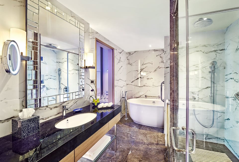 Vivanta Suite | Bathroom | Designer toiletries, hair dryer, bathrobes, slippers