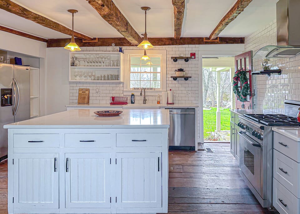 The pristine white cabinetry offers a clean, uncluttered aesthetic.