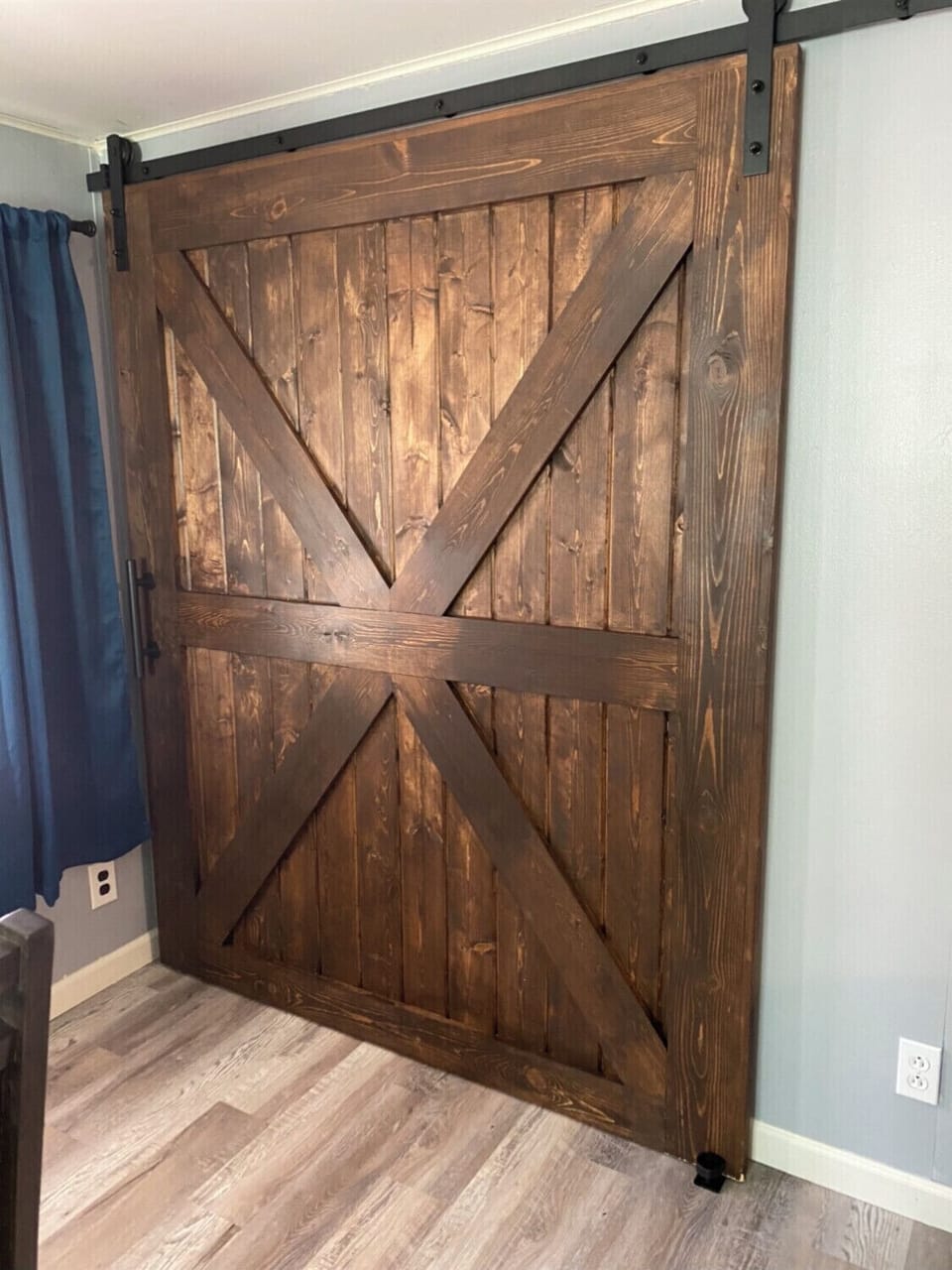 Hand-crafted custom barn doors add charm to our little bungalow.
