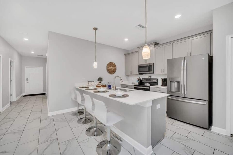 Enjoy a home cooked meal in this modern kitchen.