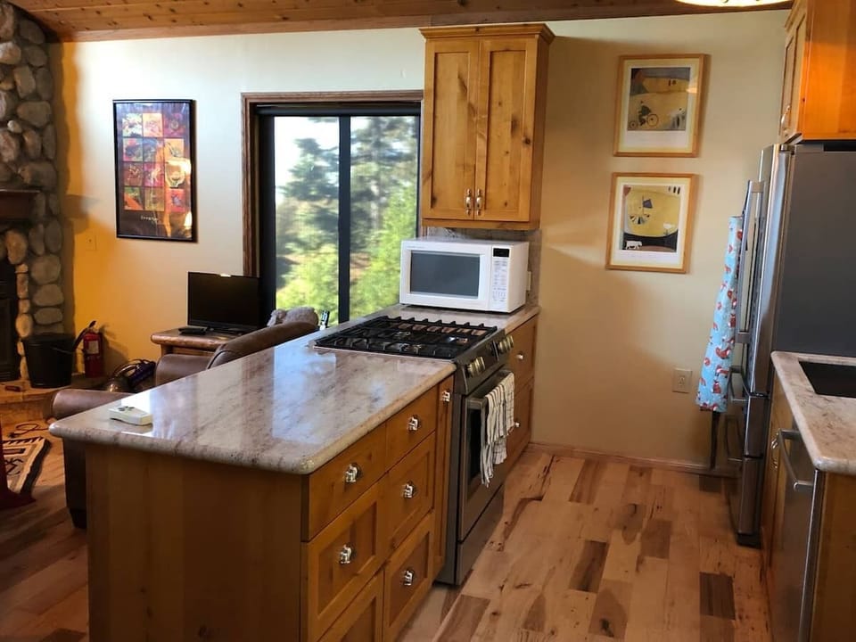Kitchen island, with gas range and convection microwave.