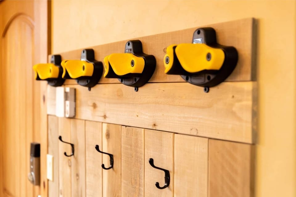 Make use of the rubberized hooks right by the front door — perfect for storing your skis or other gear!