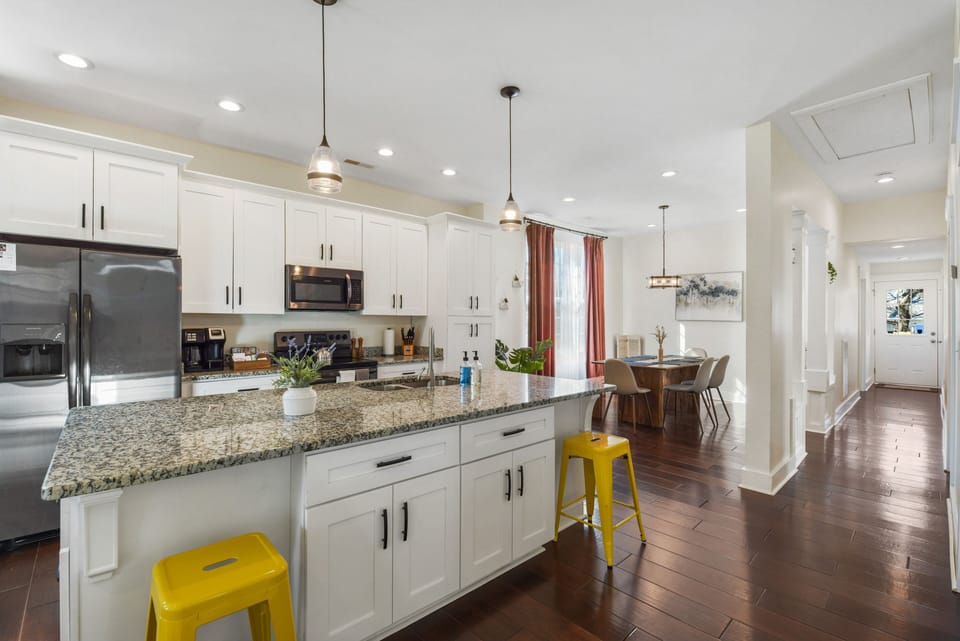 Kitchen area with a large granite island