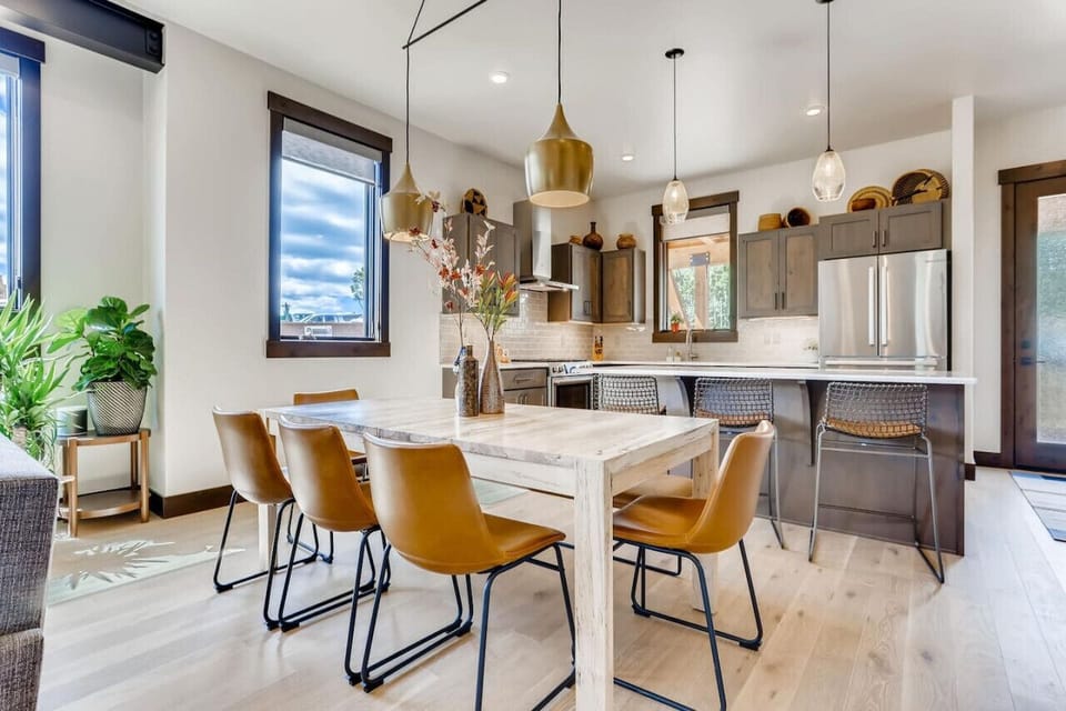 Dining area offering seating for eight and additional seating at the kitchen island